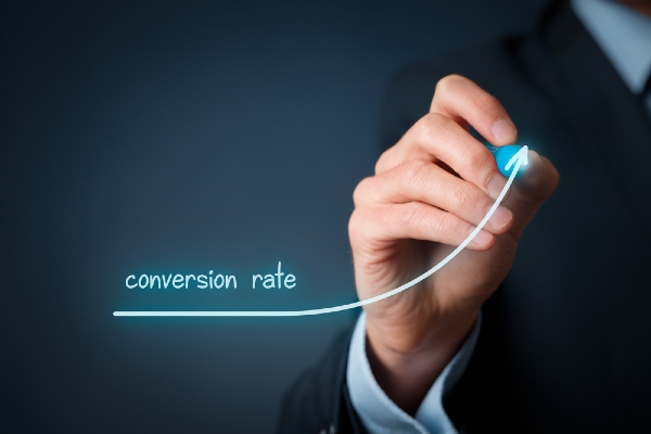 image of hand showing conversion rate trending upward - for conversion rate optimization basics article